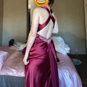 Red dress, has gems on front and back, has train, worn once, dry cleaned once.